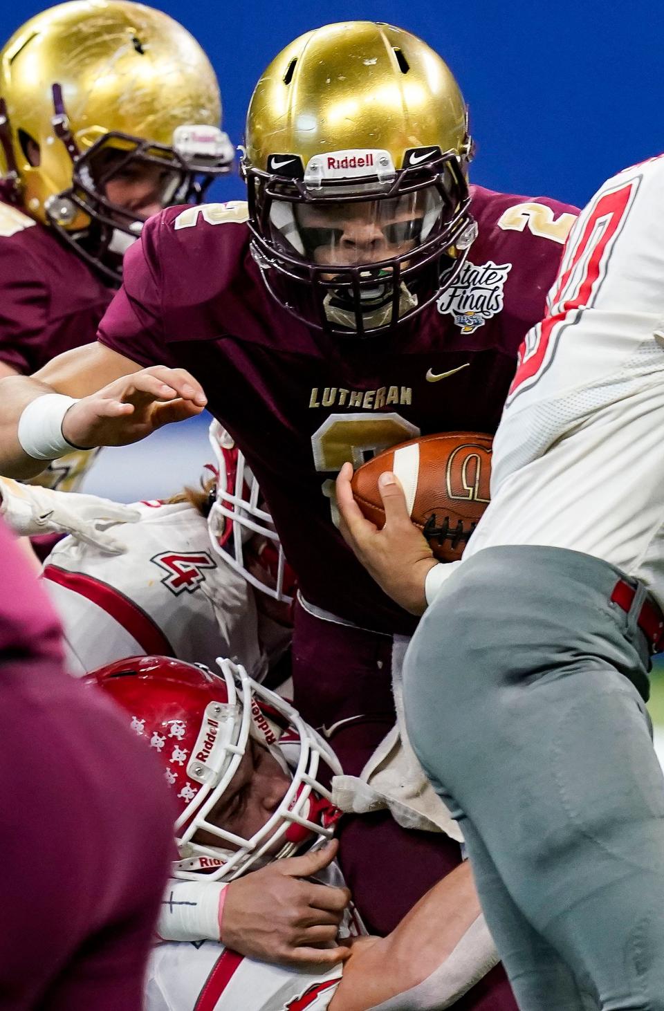 Indianapolis Lutheran Saints Montasi Clay (2) rushes the ball during the IHSAA Class A State Finals on Friday, Nov. 26, 2021, at Lucas Oil Stadium in Indianapolis. 