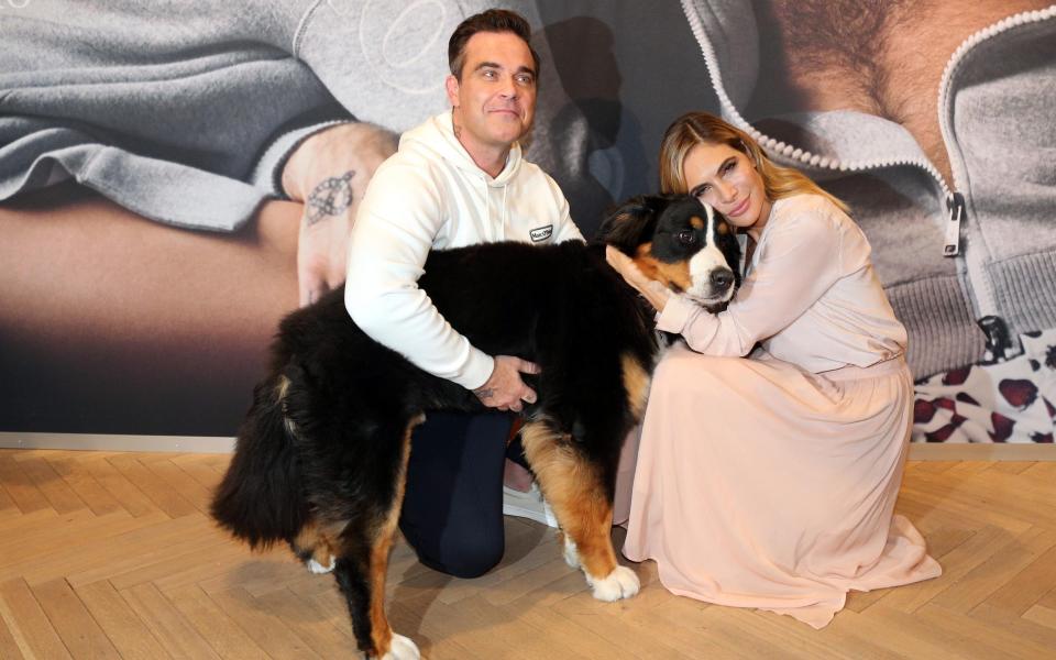 Williams and his wife Ayda Field with their dog Showbiz in 2017 - Getty