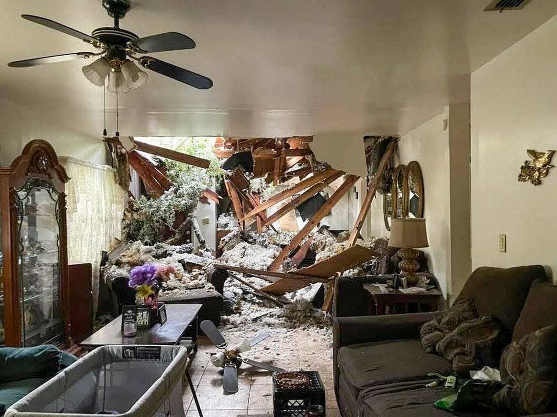 The inside of Barbara Glover’s home is seen after a tree crashed through the roof last year during Hurricane Ian last year.