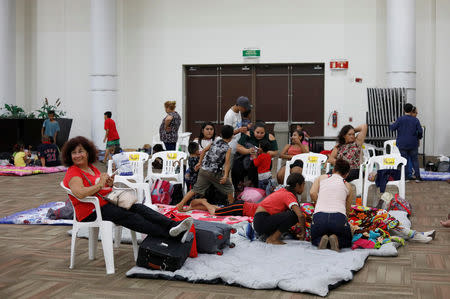 People who were evacuated from their homes are seen in a big room at the Convention Center being used as a shelter while Hurricane Willa approaches the Pacific beach resort, Mexico October 23, 2018. REUTERS/Henry Romero