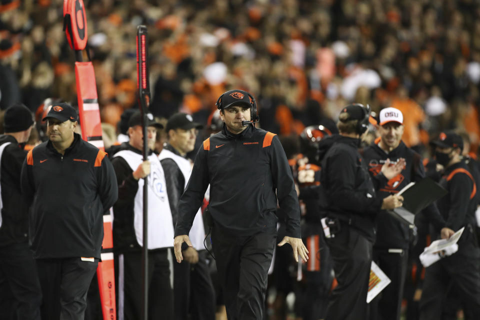 Oregon State coach Jonathan Smith walks the sideline during the second half of the team's NCAA college football game Saturday, Oct. 23, 2021, in Corvallis, Ore. (AP Photo/Amanda Loman)