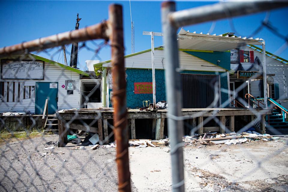 Trico Shrimp on San Carlos Island on Fort Myers Beach sits wrecked on Wednesday, Sept. 13, 2023. Nearly a year after Hurricane Ian tossed most of the shrimp boats ashore, the business has been closed.