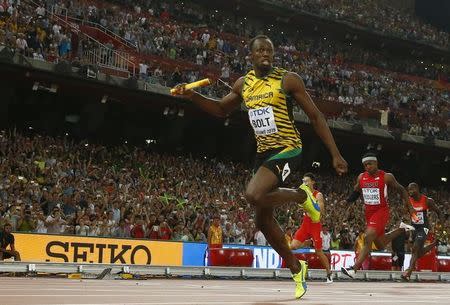 Usain Bolt of Jamaica crosses the finish line to win the men's 4 x 100 metres relay final during the 15th IAAF World Championships at the National Stadium in Beijing, China, August 29, 2015. REUTERS/Kai Pfaffenbach