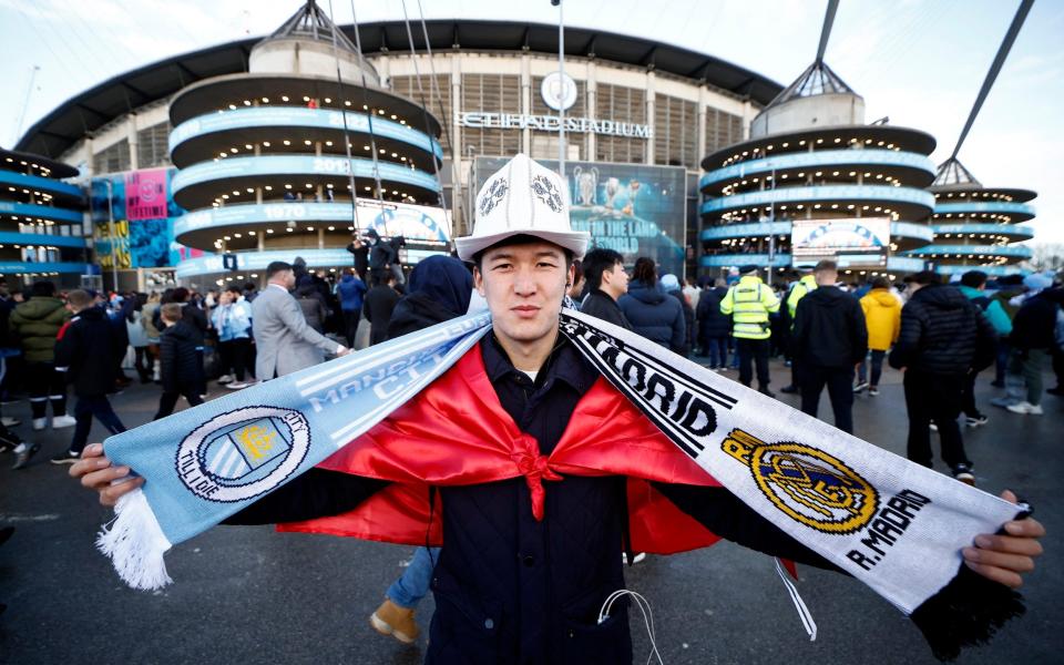 Fan outside the stadium before the match