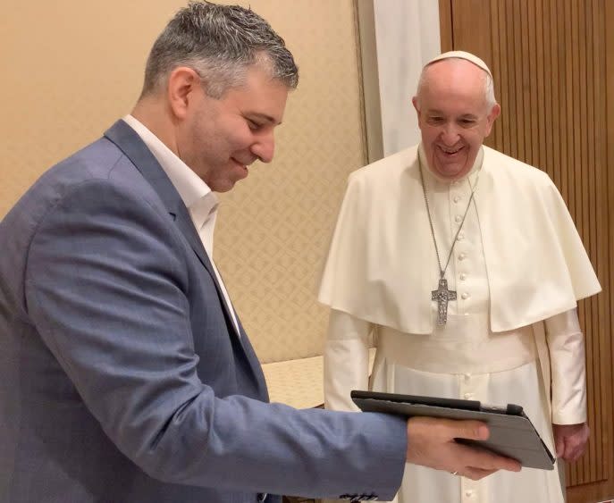 Director Evgeny Afineevsky shows scenes from Francesco to Pope Francis at the Vatican, September 2020 - Credit: Courtesy Francesco Docet Production
