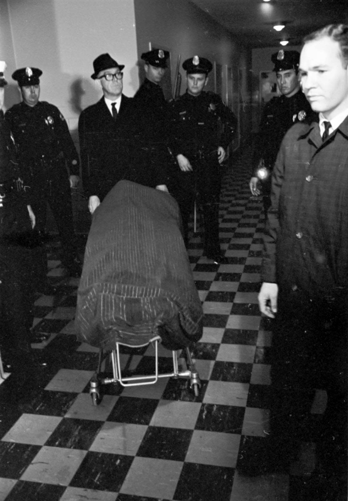 Nov. 24, 1963: Lee Harvey Oswald’s body guarded by police at Parkland Hospital waiting for pick up by Miller Funeral Home.