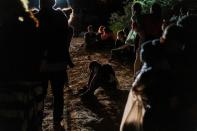 FILE PHOTO: Asylum-seeking migrants cross the Rio Grande river in Roma, Texas