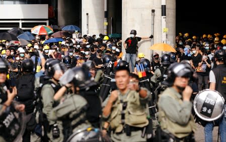 Demonstrators march to protest against the Yuen Long attacks in Yuen Long