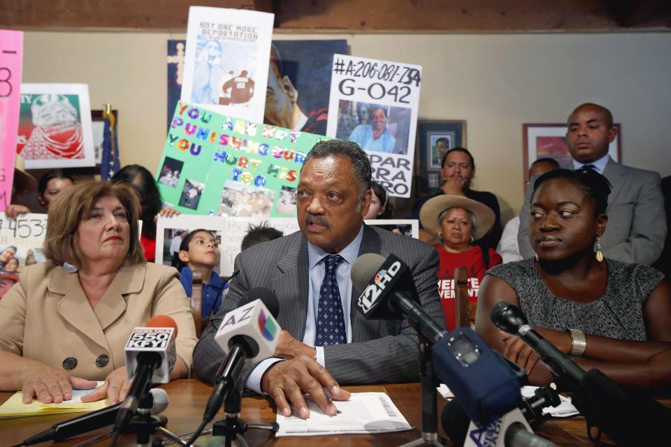 FILE - In recognition of International Workers Day, Rev. Jesse Jackson, Sr., center, of the Rainbow PUSH Coalition, speaks during a news conference on issues affecting minority communities in Arizona and across the U.S., including asking for an end to deportations, a call for immigration reform, passage of a new voting rights act, a raise in the minimum wage and other issues on Thursday, May 1, 2014, in Phoenix. Flanking Jackson are Maricopa County Board of Supervisors member Mary Rose Wilcox, left, and Tia Oso, coordinator of Black Immigration Network. Jackson plans to step down from leading the Chicago civil rights organization Rainbow PUSH Coalition he founded in 1971, his son's congressional office said Friday, July 14, 2023. (AP Photo/Ross D. Franklin, File)