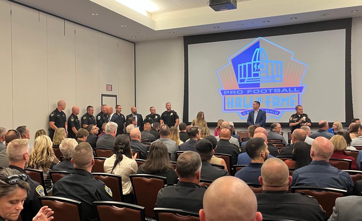 Canton police officer Zach Taylor, far right, was among several police officers in northern Ohio honored for being "honorable mention" for the U.S. Marshals Wayne Leon Task Force Officer of the Year award at the Pro Football Hall of Fame Thursday.