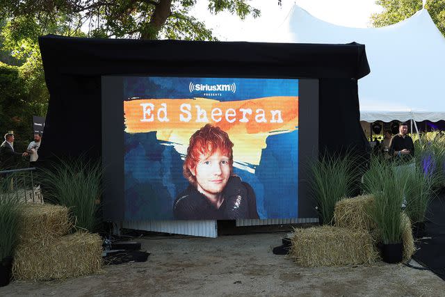 <p>Kevin Mazur/Getty</p> Ed Sheeran performs live for SiriusXM at the Stephen Talkhouse in Amagansett, New York.