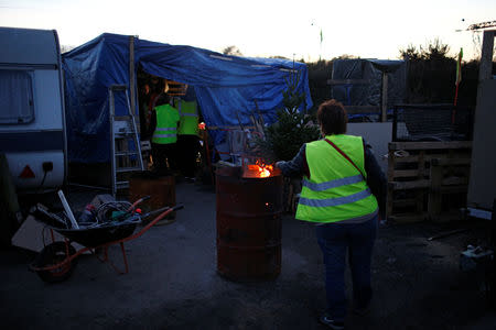 Yellow vest protesters are gather at their makeshift shelter near the Nantes Atlantique Airport as the "yellow vests" movement continues, in Bouguenais, France, December 10, 2018. REUTERS/Stephane Mahe