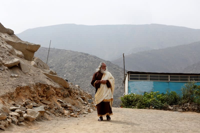 A member of the Christian evangelical church Israelite Mission of the New Universal Pact walks at the group's main temple, on the outskirts of Lima