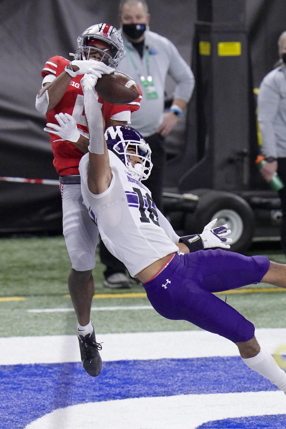 Northwestern defensive back Brandon Joseph (16) intercepts a pass intended for Ohio State wide receiver Garrett Wilson in the end zone during the first half of the Big Ten championship NCAA college football game, Saturday, Dec. 19, 2020, in Indianapolis. (AP Photo/AJ Mast)