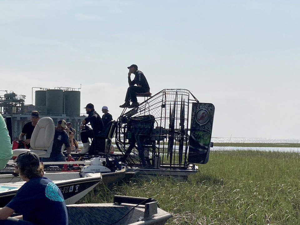 Volunteers on boats gather on Thursday, April 29, 2021, on the water along the Louisiana coast before setting out to look for survivors the Seacor Power, a lift boat that capsized on April 13. Volunteers have been searching by air and boat for any sign of the seven people still missing. (AP Photo/Rebecca Santana)