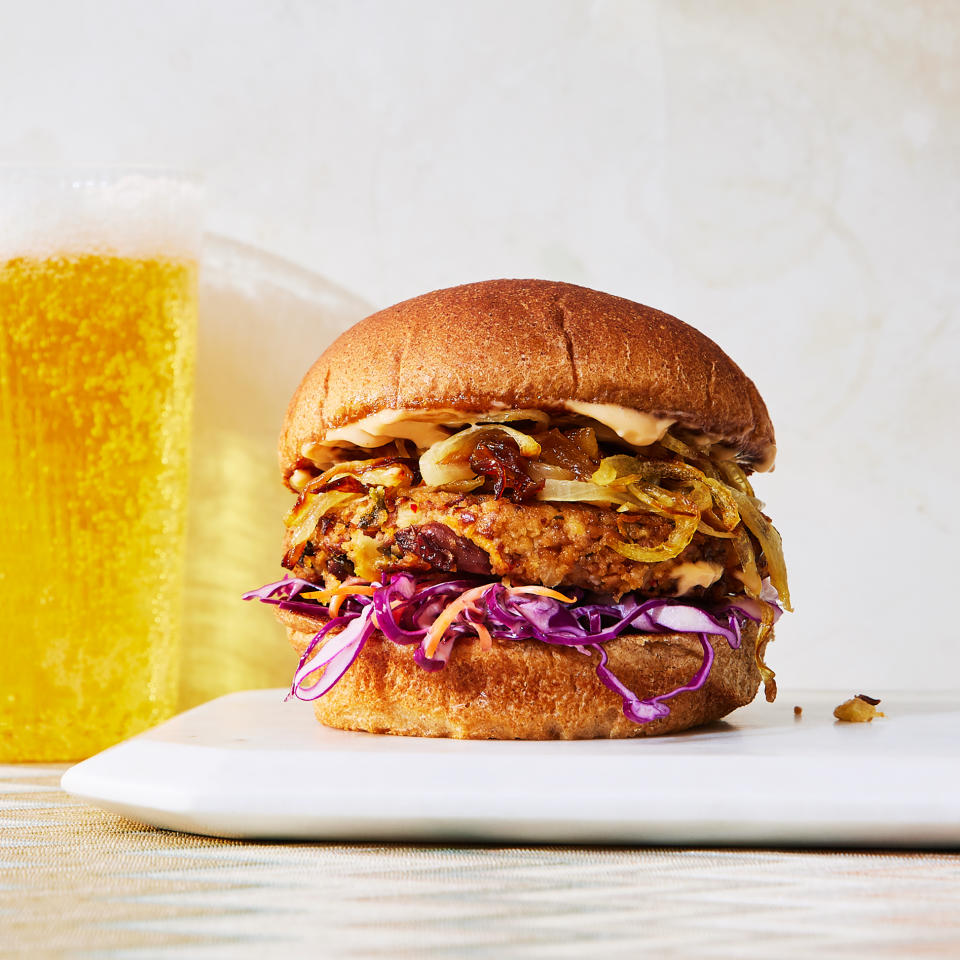 <p>These flavor-packed burgers get tang from kimchi, umami from soy or fish sauce and heat from gochugaru. Topped with caramelized onions and slaw, they're super-satisfying. <a href="https://www.eatingwell.com/recipe/7952202/smothered-black-soybean-burgers/" rel="nofollow noopener" target="_blank" data-ylk="slk:View Recipe;elm:context_link;itc:0;sec:content-canvas" class="link ">View Recipe</a></p>