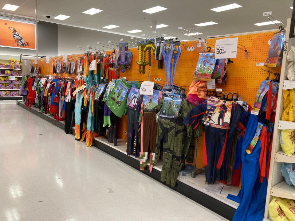 An aisle of Halloween costumes at Target.