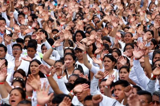 Followers of the Pentecostal church Light of the World take part in a "Youth With Values" walk along Guadalajara's main avenue