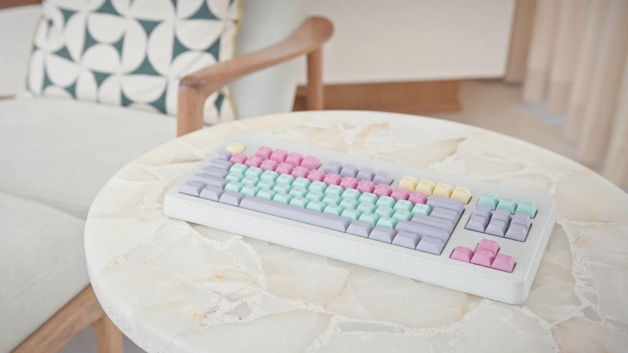  Promotional photo of a Norbauer mechanical keyboard on a table. 