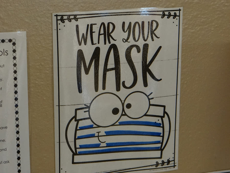 Age-appropriate reminders to wear masks are posted all over St. Stanislaus school. (Patrick O’Donnell)