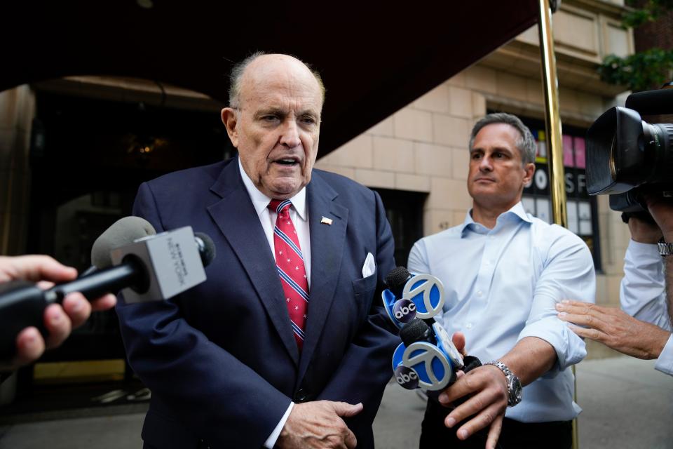 Former Mayor of New York Rudy Giuliani speaks to reporters as he leaves his apartment building in New York on Aug. 23, 2023.