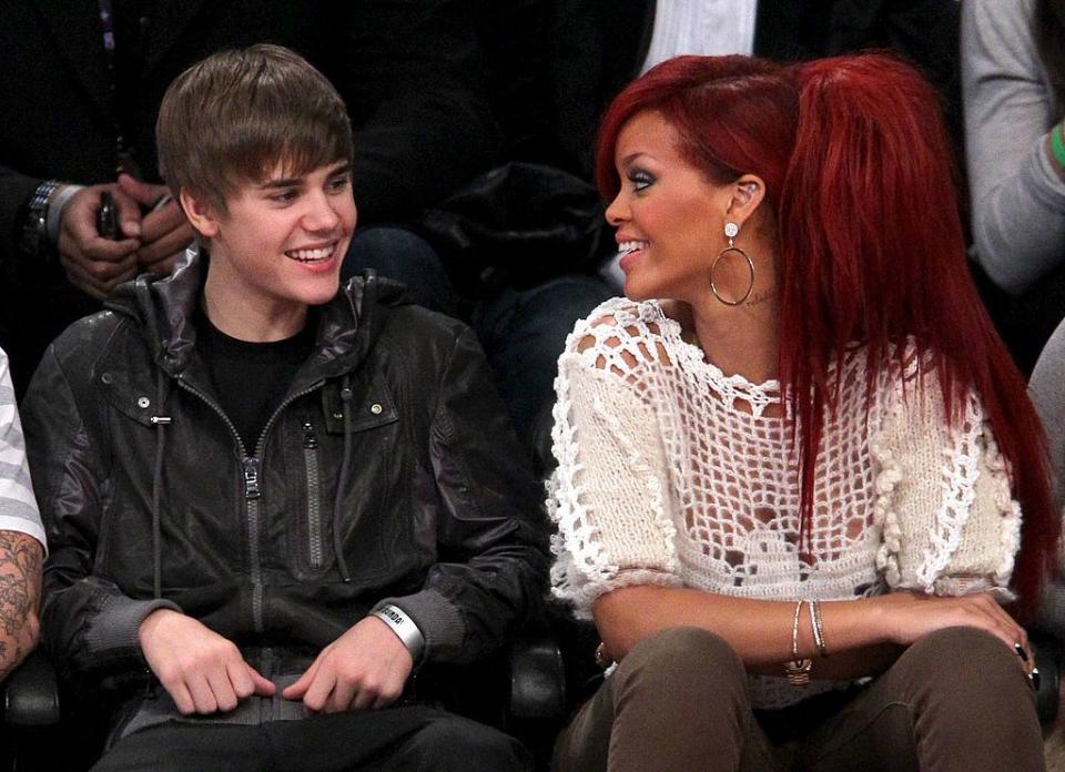 los angeles, ca february 20 singers justin bieber l and rihanna sit in the audience during the 2011 nba all star game at staples center on february 20, 2011 in los angeles, california note to user user expressly acknowledges and agrees that, by downloading and or using this photograph, user is consenting to the terms and conditions of the getty images license agreement photo by noel vasquezgetty images