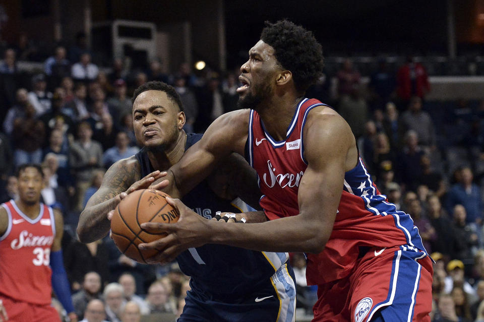 Philadelphia 76ers center Joel Embiid, right, drives against Memphis Grizzlies forward Jarell Martin in the second half of an NBA basketball game Monday, Jan. 22, 2018, in Memphis, Tenn. (AP Photo/Brandon Dill)