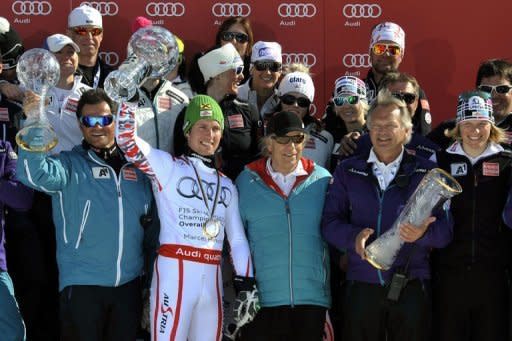 Overall World Cup winner Austria's Marcel Hirscher (2nd L) celebrates with the Austrian team during the FIS Alpine Skiing World Cup finals in Schladming on Sunday