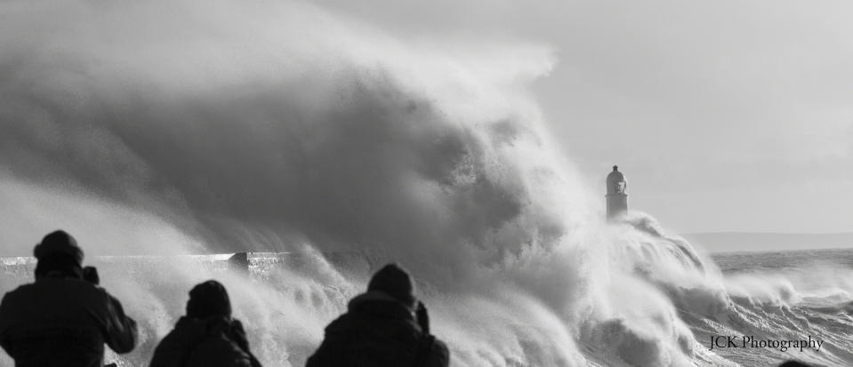 January 22: Porthcawl Pier by<a href="http://www.flickr.com/photos/105533057@N06/11821275145" rel="nofollow noopener" target="_blank" data-ylk="slk:joshken82;elm:context_link;itc:0;sec:content-canvas" class="link "> joshken82</a>. "After checking my local surf spot. I thought I would venture over to the seawall to see the waves smashing into the seawall at Porthcawl Pier in Wales. I couldn't believe the amount of spray exploding off the wall. it was crazy to watch. I included the people in this image as I wanted to give a sense of scale of the size of waves. It was great to experience the sheer scale of power the sea has. Someone has also pointed out that a face can been seen in this image - its very weird!"