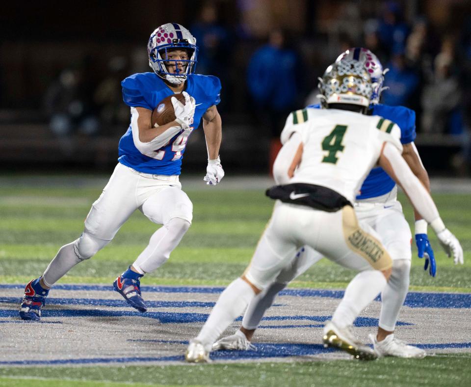 Hamilton Southeastern Royal Jalen Alexander (24) runs the ball upfield Friday, Nov. 11, 2022, at Hamilton Southeastern High School in Fishers. 