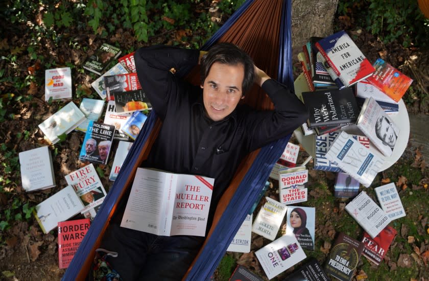 BETHESDA, MD - OCTOBER 5, 2020 : Washington Post reporter Carlos Lozada has read over 150 books on Donald Trump. Lozada's book "What Were We Thinking: A Brief Intellectual History of the Trump Era" is a compendium of 150 books on a man we already know too much about. (Kirk McKoy / Los Angeles Times)