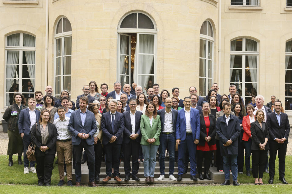 Leaders of France left-wing coalition for the upcoming election pose for a group photo after a media conference in Paris, Friday, June 14, 2024. Leaders of France's left-wing parties, allied in a coalition known as the New Popular Front on Friday outlined their plan to fend off the far-right from claiming power at the upcoming snap national election. (AP Photo/Thomas Padilla)