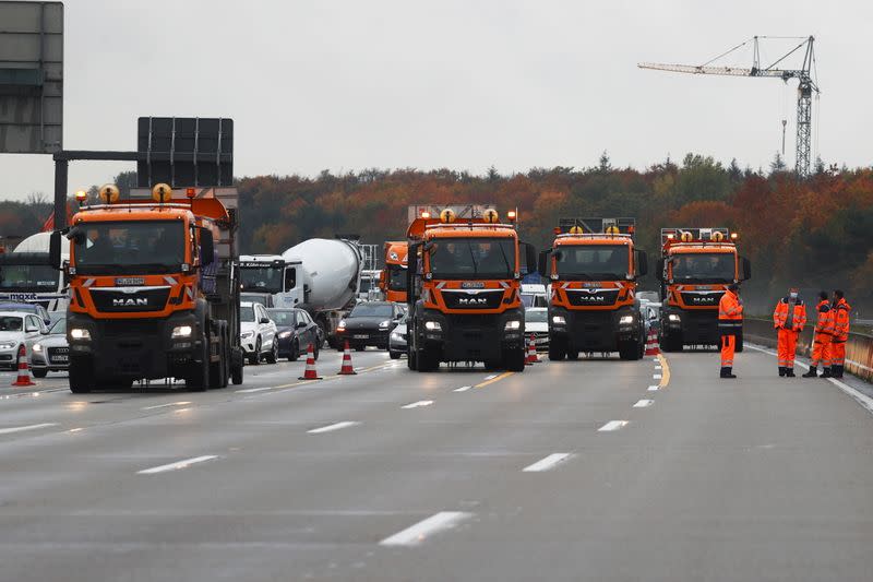 Activists hang on a bridge of A5 highway near Frankfurt causing traffic jams