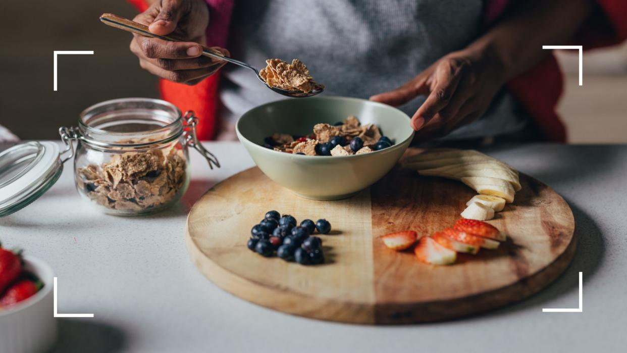  Bowl of cereal and fruit being prepared early in the morning, representing not doing exercise on an empty stomach. 