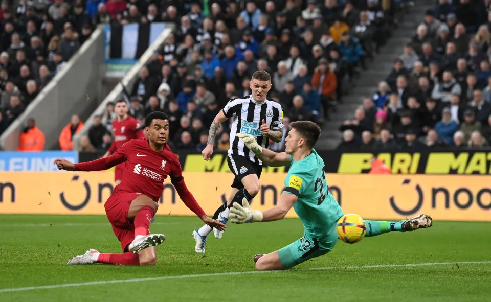 NEWCASTLE UPON TYNE, ENGLAND - FEBRUARY 18: Cody Gakpo of Liverpool scores the team&#39;s second goal past Nick Pope of Newcastle United during the Premier League match between Newcastle United and Liverpool FC at St. James Park on February 18, 2023 in Newcastle upon Tyne, England. (Photo by Stu Forster/Getty Images)