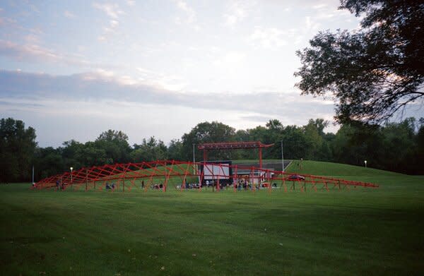 Families gather between Studio Zewde’s <i>Echoes of the Hill</i> and the nearby hillside in <i>Mill Race Park</i> (1993).