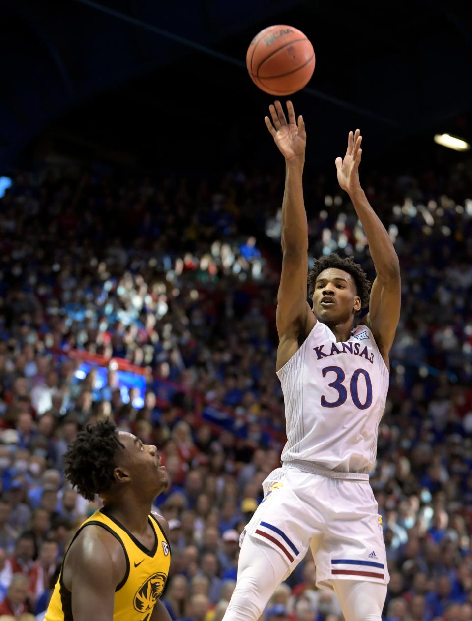 Ochai Agbaji takes a shot inside Allen Fieldhouse during Kansas' win against Missouri on Dec. 11, 2021.