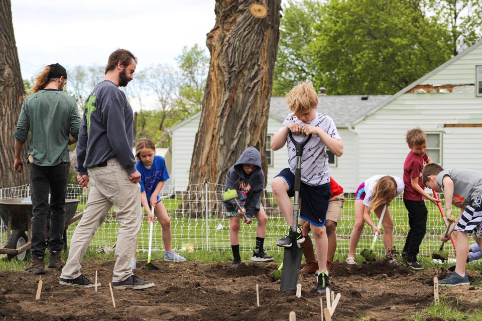 Megan and Dan EisenVos, owners of the new nonprofit IronFox Farm, started a program with third- and fourth-graders from Eugene Field A+ Elementary where they teach the students about gardening. The students planted vegetables on the IronFox lot in Sioux Falls on Tuesday, May 17.