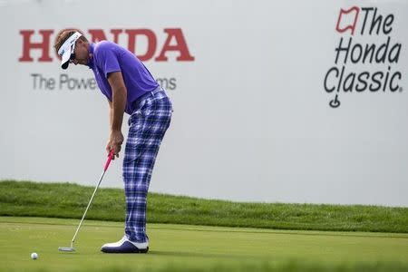 Mar 1, 2015; Palm Beach Gardens, FL, USA; Ian Poulter putts for birdie on the 16th hole during the third round of the Honda Classic at PGA National GC Champion Course. Peter Casey-USA TODAY Sports