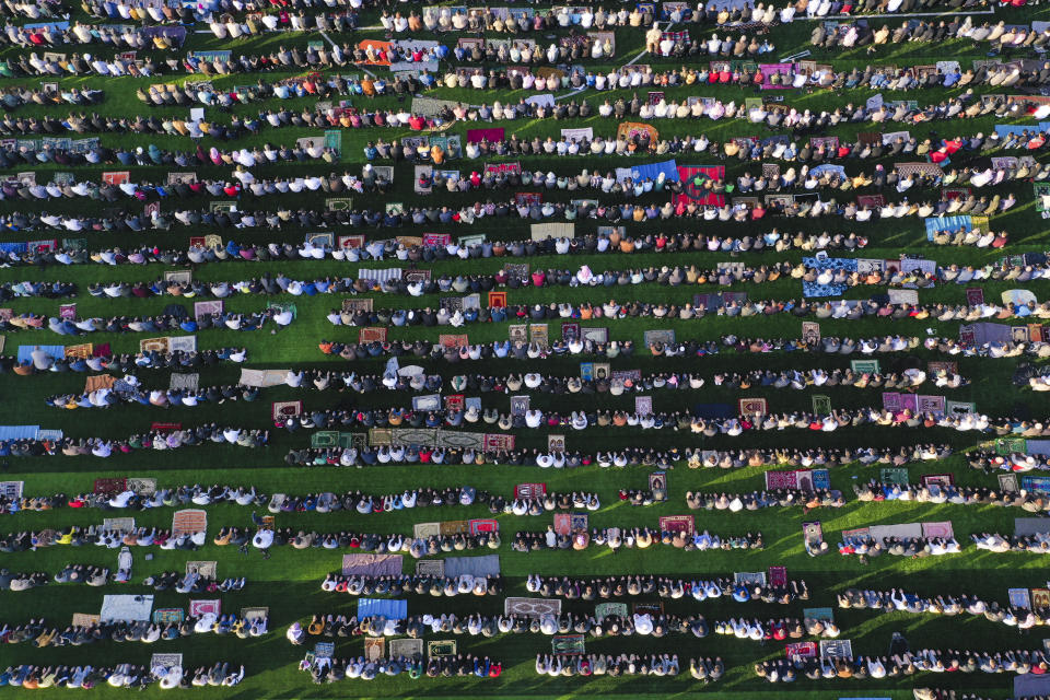 People attend Eid al-Fitr prayer at a stadium in the city of Idlib, Syria, Friday, April 21, 2023. Eid al-Fitr holiday marks the end of the Islamic holy month of Ramadan. (AP Photo/Ghaith Alsayed)