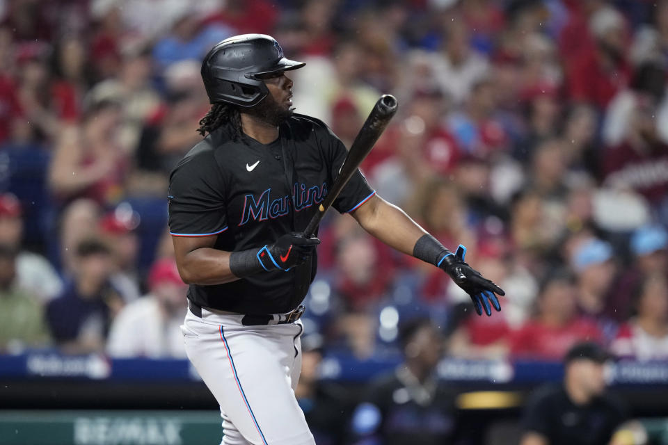 Miami Marlins' Josh Bell watches after hitting a run-scoring double against Philadelphia Phillies pitcher Aaron Nola during the fifth inning of a baseball game, Saturday, Sept. 9, 2023, in Philadelphia. (AP Photo/Matt Slocum)