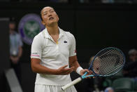 France's Harmony Tan reacts as she plays Serena Williams of the US in a first round women's singles match on day two of the Wimbledon tennis championships in London, Tuesday, June 28, 2022. (AP Photo/Alberto Pezzali)