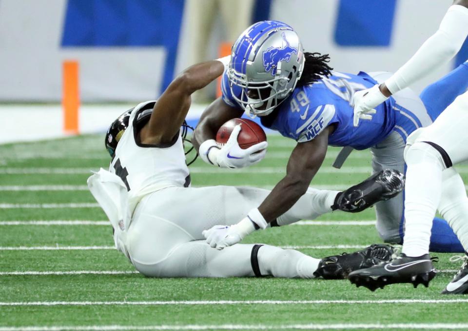 Detroit Lions cornerback Starling Thomas V (49) runs the ball against the Jacksonville Jaguars during first half Saturday, August 19, 2023.