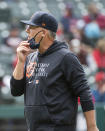 Detroit Tigers manager A.J. Hinch walks back to the dugout after making a pitching change during the eighth inning of a baseball game against the Cleveland Indians in Cleveland, Sunday, April 11, 2021. (AP Photo/Phil Long)