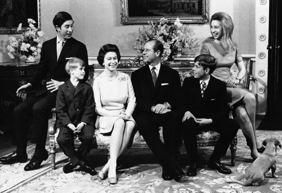 Queen Elizabeth II and Prince Philip with their family in Buckingham Palace on November 20, 1972, on the occasion of the royal couple's silver wedding anniversary. From left: Princess Charles, Prince Edward, the queen, Prince Philip, Prince Andrew, and Princess Anne. Also pictured, with its back to the camera, is one of the royal dogs, Pickees.  / Credit: AP Photo