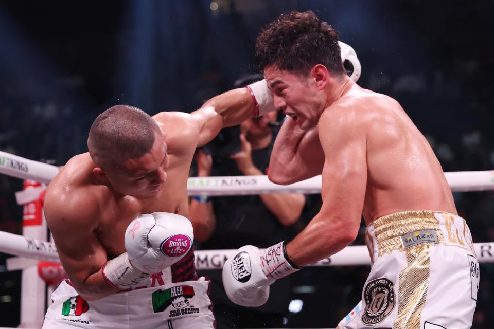 Cruz, left, tries to land a left hook on Cabrera (Getty Images)