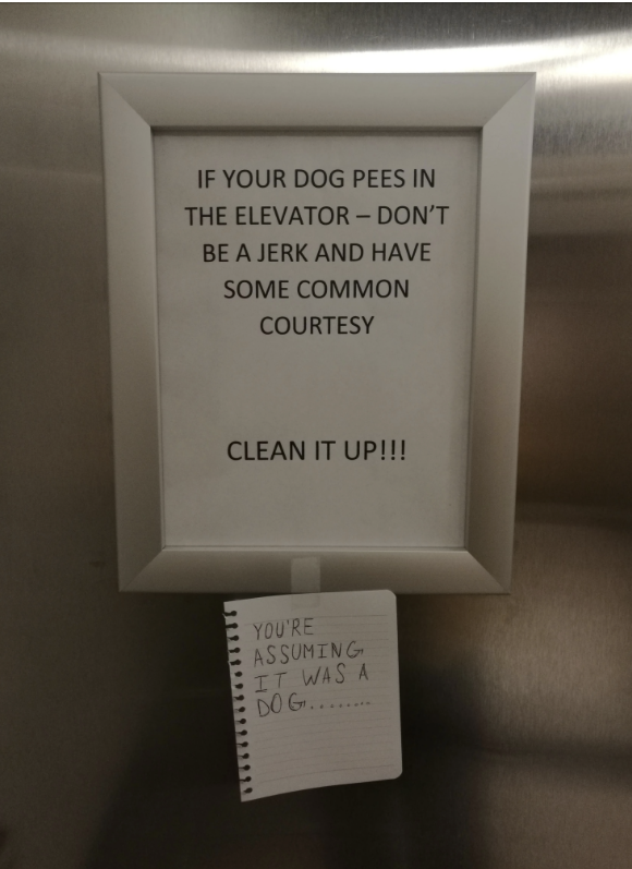 Sign saying, "IF YOUR DOG PEES IN THE ELEVATOR – DON'T BE A JERK AND HAVE SOME COMMON COURTESY. CLEAN IT UP!!!" with a note below reading, "YOU'RE ASSUMING IT WAS A DOG..."