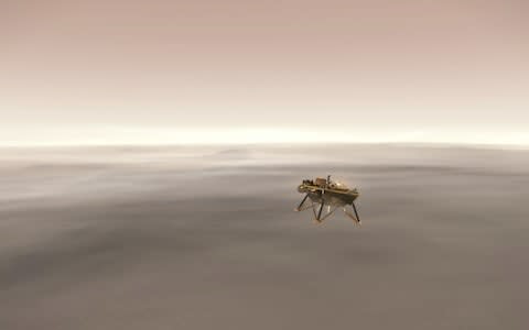 This NASA illustration shows a simulated view of the InSight lander firing retrorockets to slow down as it descends toward the surface of Mars - Credit: AFP