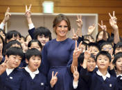 <p>First lady Melania Trump poses for a photo with schoolchildren upon arrival at Kyobashi Tsukiji Elementary School in Tokyo, Monday, Nov. 6, 2017. (Photo: Ping Ma/Pool Photo via AP) </p>