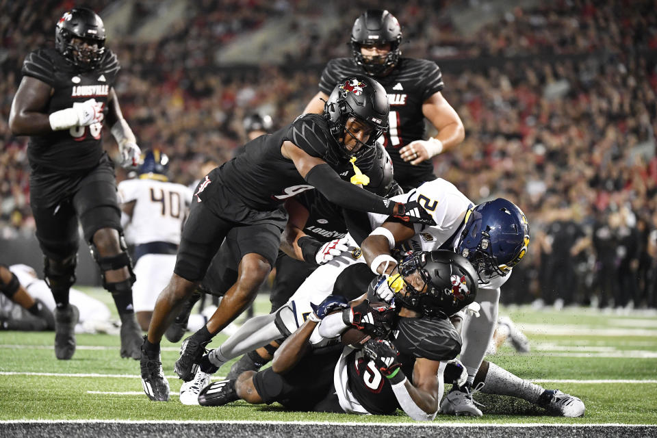 Louisville running back Jawhar Jordan (25) is brought down just short of the goal line during the second half of the team's NCAA college football game against Murray State in Louisville, Ky., Thursday, Sept. 7, 2023. (AP Photo/Timothy D. Easley)